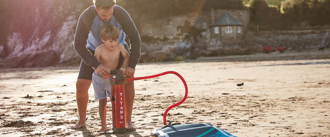 Red-Paddle-Inflatable-SUP-pump-man-kid-beach-lifestyle-Stand-Up-Surf-Shop 1300x540