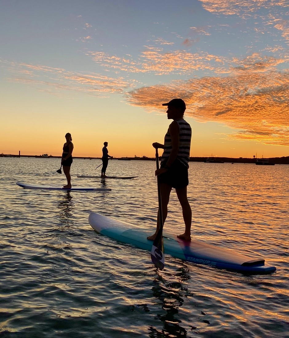Stand Up Surf Shop SUP lessons ocean paddle sunset 940x1100