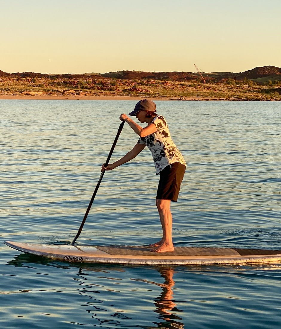 Sunova Stand Up Surf Shop SUP woman paddling sunset 940x1100